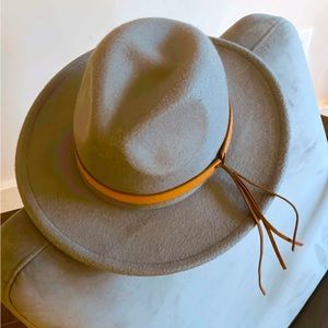 Grey hat with removable tassel